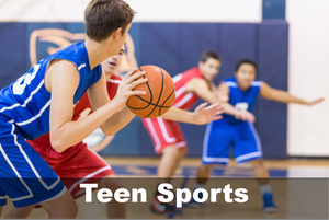 Two teen basketball teams playing basketball against each other